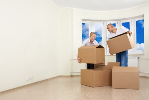 Professional removals team handling boxes and furniture in Harringay