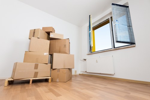 Removal team handling furniture in a Harringay home