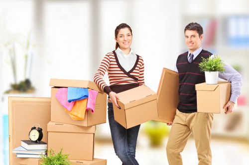 Careful wrapping of fragile household items during a move
