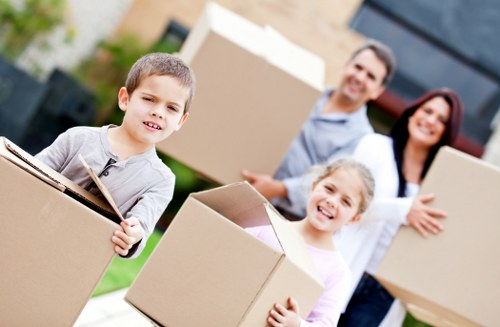 Loading boxes and furniture into a moving truck in Harringay