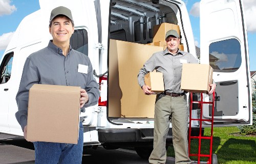 Packed household boxes and furniture prepared for house removals in Harringay