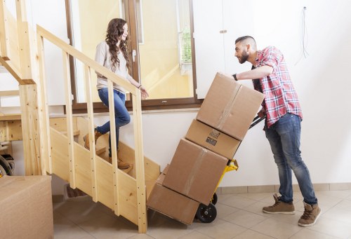 A moving team unloading items at a Harringay property